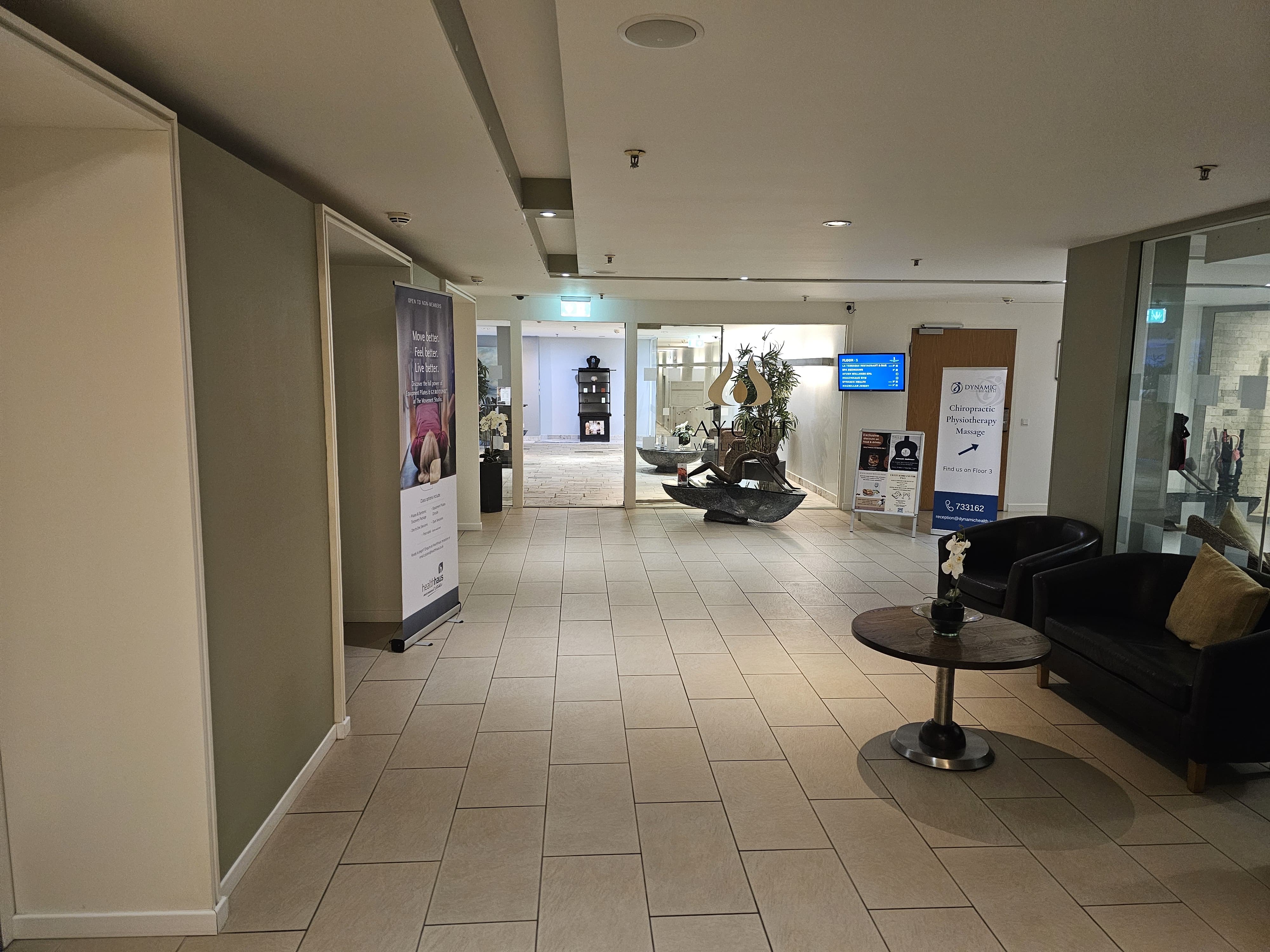 Hotel de France wellness reception today — the existing Ayush Wellness entrance and check-in area in its current finish.